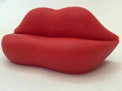 Salvador Dali "Lips" Sofa Desk Dsiplay: The "Lips Sofa" is a distinctive and iconic piece of furniture designed by Italian artist and designer Salvador Dali­ in 1936. Officially known as the "Bocca Sofa," it is sometimes referred to simply