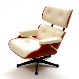 Eames White Lounge Chair Desk Display: The Eames Lounge Chair and Ottoman, often simply referred to as the "Eames Chair," is an iconic piece of furniture designed by the American design duo Charles and Ray Eames. Here are some key details