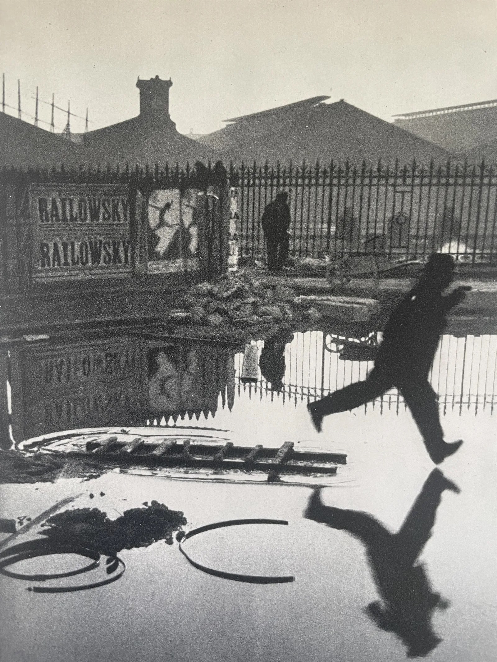 Henri Cartier Bresson "Behind Gare St. Lazare, Paris, 1932" Print: Henri Cartier-Bresson (1908-2004) was a French photographer and pioneer of modern photojournalism. He is widely considered one of the greatest photographers of the 20th century. Cartier-Bresson's work