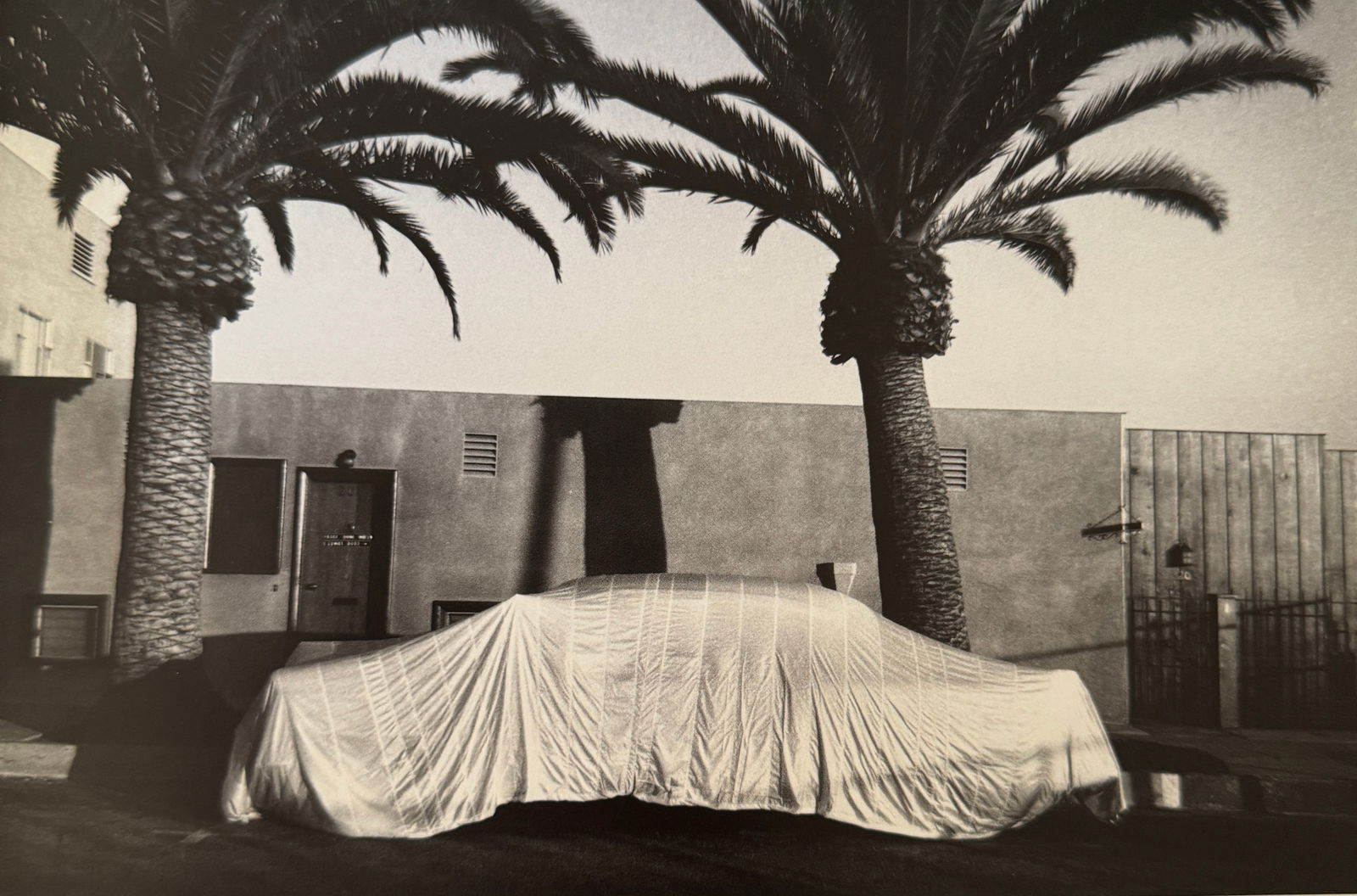 Robert Frank "Covered Car, Long Beach, California" Print: Robert Frank (1924–2019) was a Swiss-American photographer and filmmaker, best known for his groundbreaking book "The Americans." Born on November 9, 1924, in Zurich, Switzerland, Frank became one o