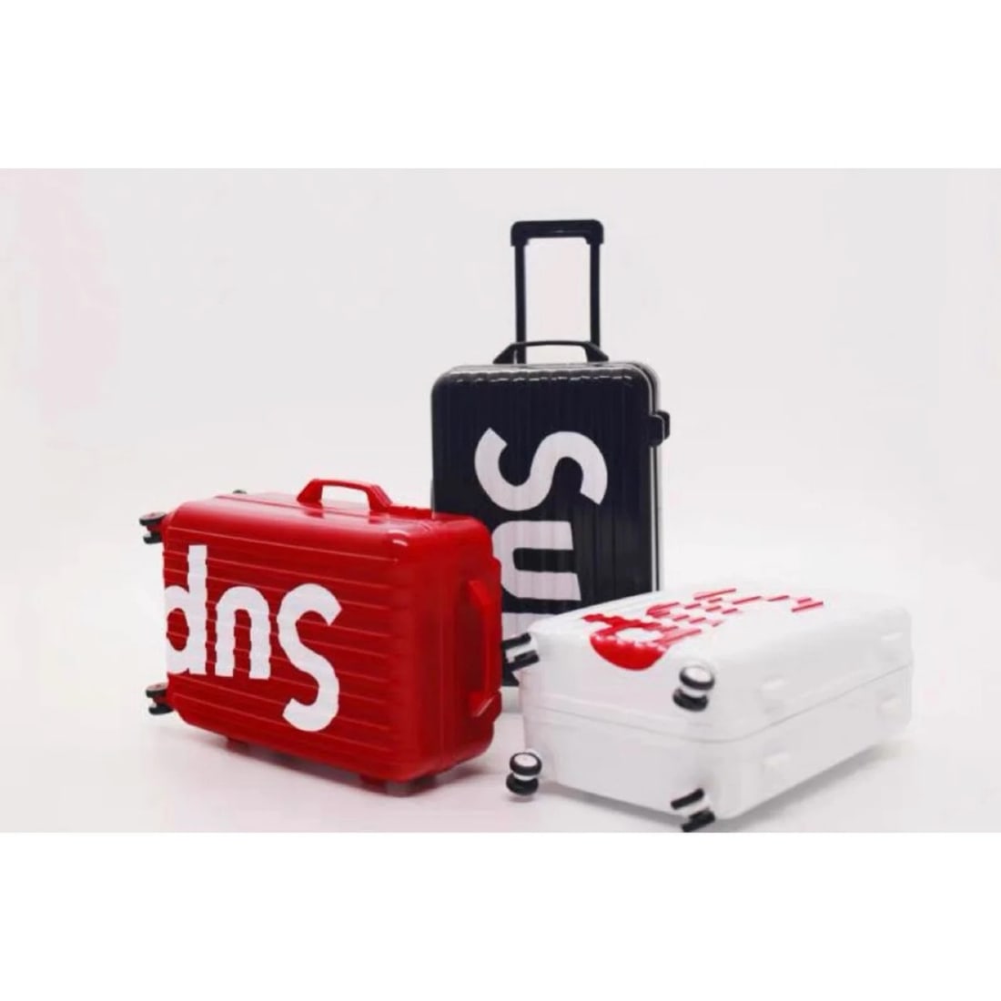 Set of Three 1/6 Scale Suitcases: Supreme is a streetwear and skateboarding brand that originated in New York City. It was founded in April 1994 by James Jebbia. Supreme has become one of the most iconic and influential streetwear bra