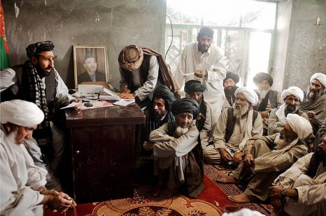 Moises Saman "Local Elders Meet in Afghanistan, 2010" Photo Print: Moises Saman is a Spanish-American photojournalist and documentary photographer known for his powerful and evocative work covering conflicts and social issues around the world. Born on November 12, 19