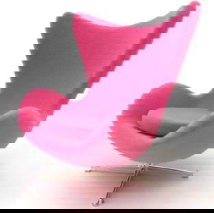 Arne Jacobsen Pink "Egg Chair" Desk Display: The Arne Jacobsen Egg Chair is an iconic piece of furniture designed by Danish architect and designer Arne Jacobsen in 1958. It is part of his larger furniture collection created for the SAS Royal
