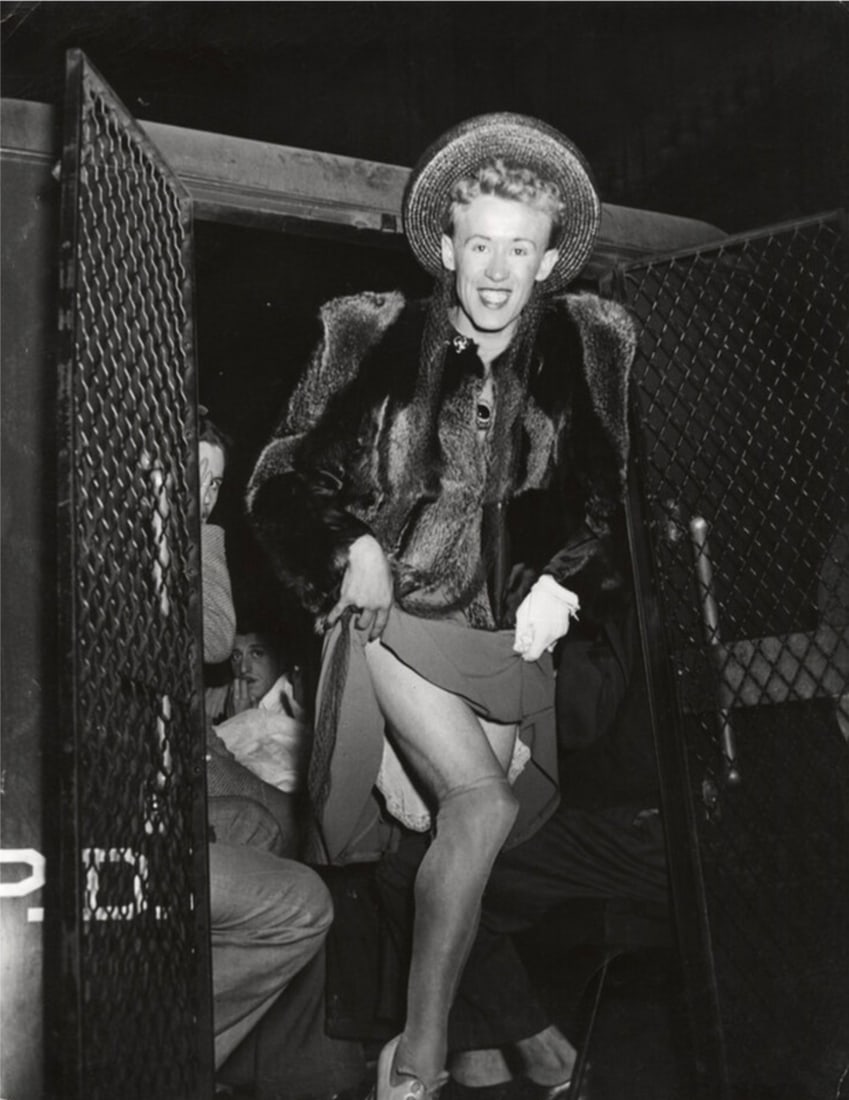 Weegee, Arthur Fellig, "Cross Dressing, Arrested, New York, 1939" Print: Weegee, born Arthur Fellig (1899–1968), was a Ukrainian-American photographer and photojournalist best known for his gritty and candid images of New York City street life in the 1930s and 1940s. He 