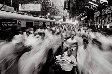 Raghu Rai "Commuters at Church Gate Railway Station, Mumbai, 1995" Photo Print: Raghu Rai is an acclaimed Indian photographer known for his extensive body of work capturing various facets of Indian life and culture. Born on December 18, 1942, in Jhang, British India (now in Pakis