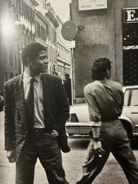 Jean-Michel Basquiat "Milan" Print.: Jean-Michel Basquiat (1960-1988) was an American artist of Haitian and Puerto Rican descent. He emerged as a prominent figure in the New York art scene in the late 1970s and 1980s. Basquiat is best kn