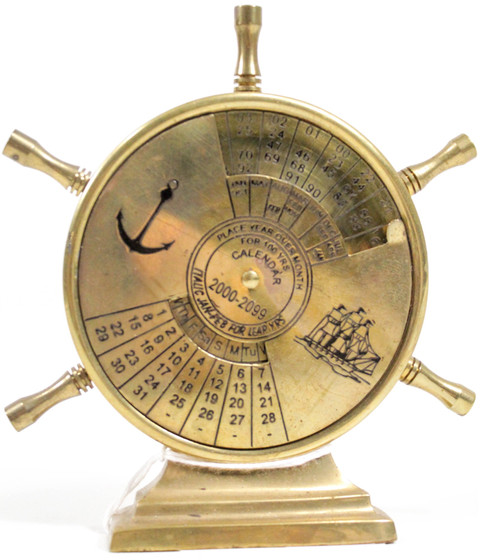 Vintage brass ship wheel 100 year calendar.: Vintage brass ship wheel 100 year calendar. Shows dates for years 2000-2099