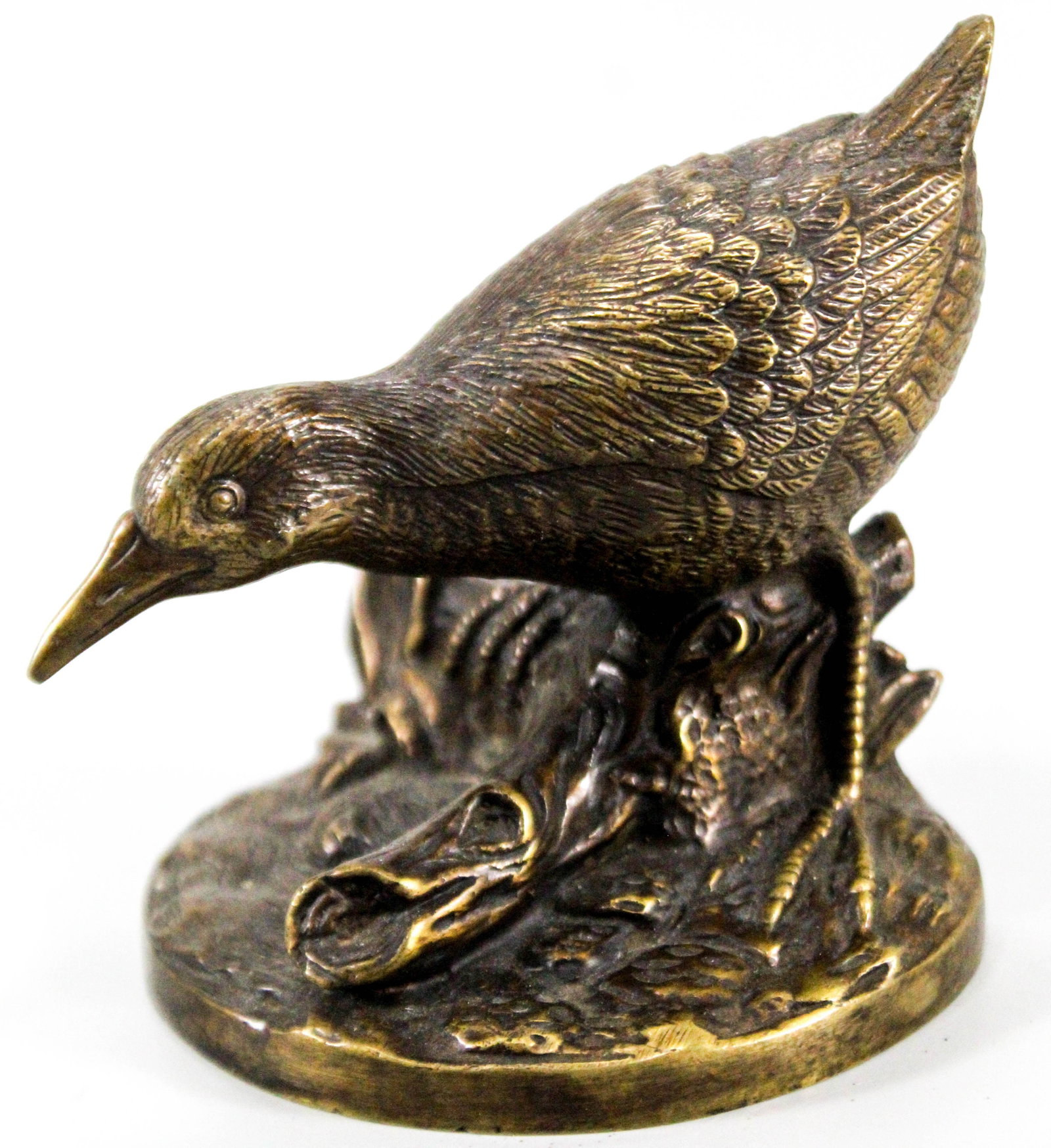 Bronze figure of a bird wading.: Bronze figure of a bird wading.