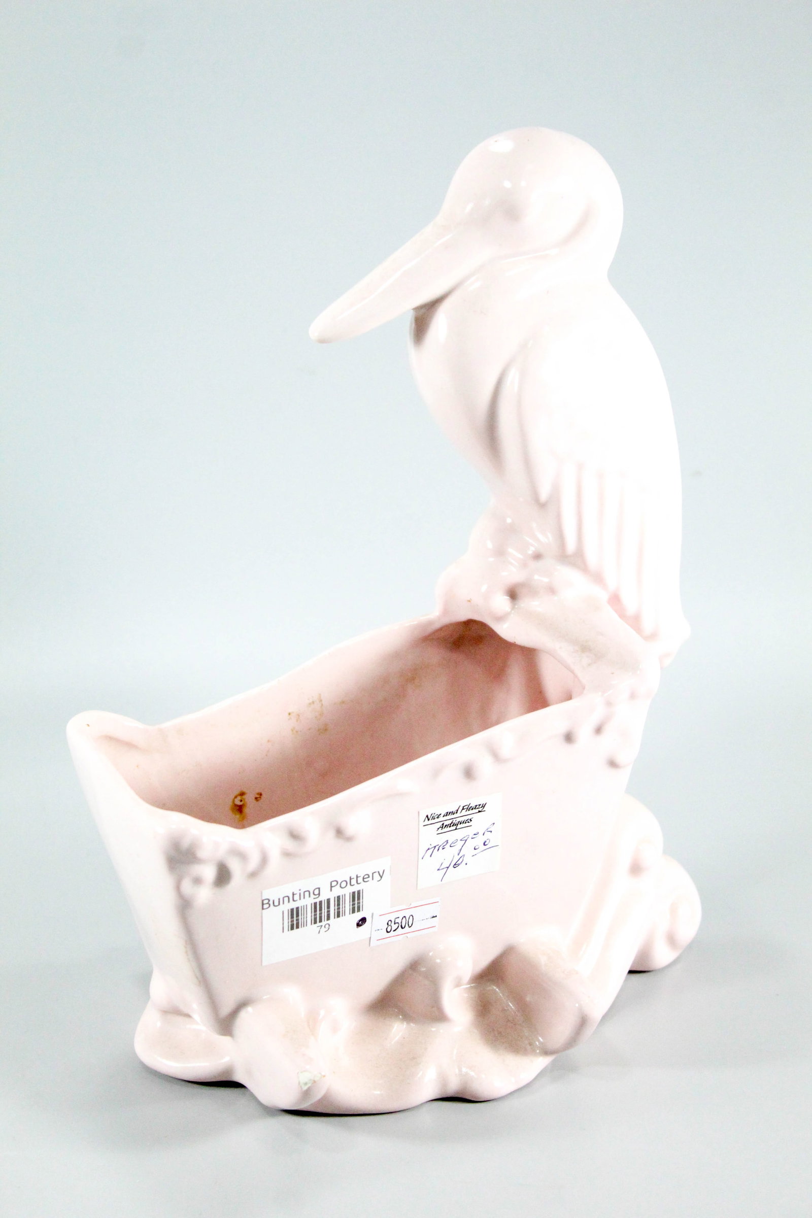 Haeger pink ceramic story and cradle vase.: Haeger pink ceramic story and cradle vase.