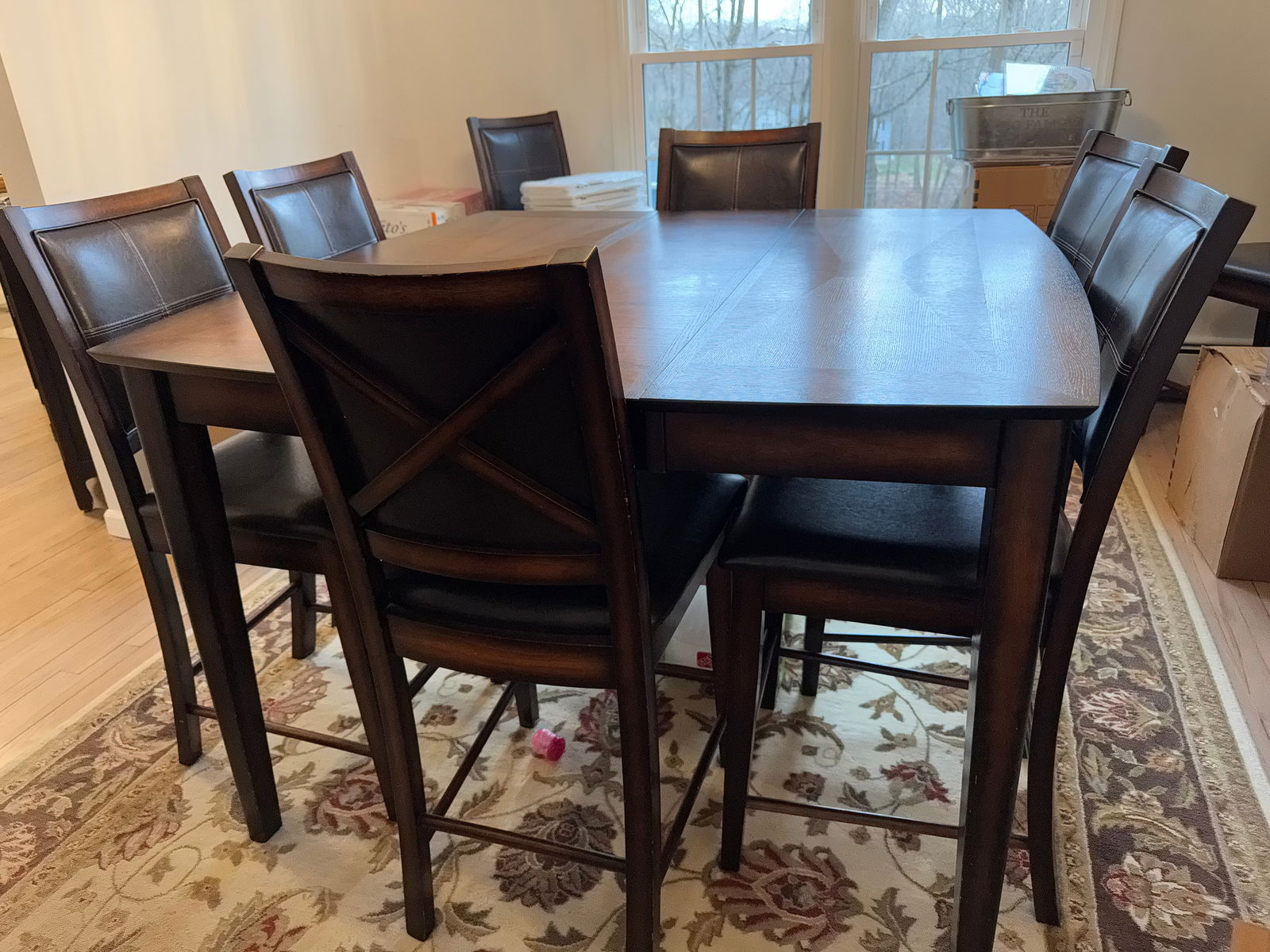 Counter Height Dining Table Set & 8 Chairs: This is a counter height Dining Table with eight armless chairs. Set in good condition with some minor scratches on the top of the table. Dimensions: Table: 54” square x 36” H;Chairs: 42&r