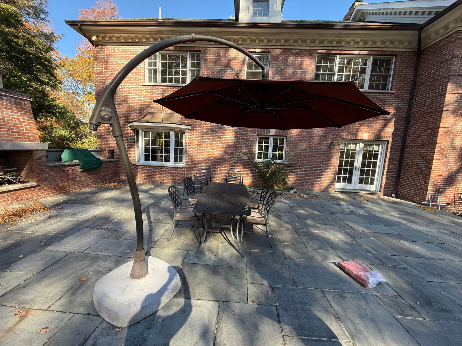 Cantilever Umbrella with Stand: Large cantilever umbrella, heavy stand and arm - 10 feet highComes also with new red umbrella in bag