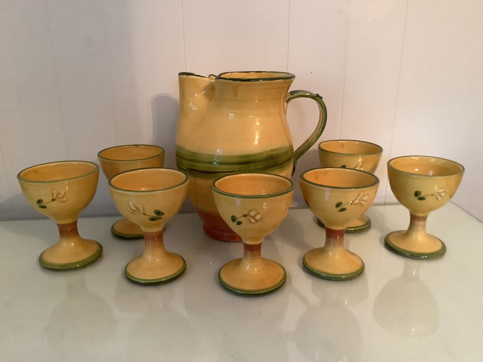 Vintage Italian Amalfi Collection Stoneware Pitcher And Goblets: Vintage hand-painted stoneware pottery pitcher & seven goblets from the Amalfi Collection made in Italy. The set is in good vintage condition.