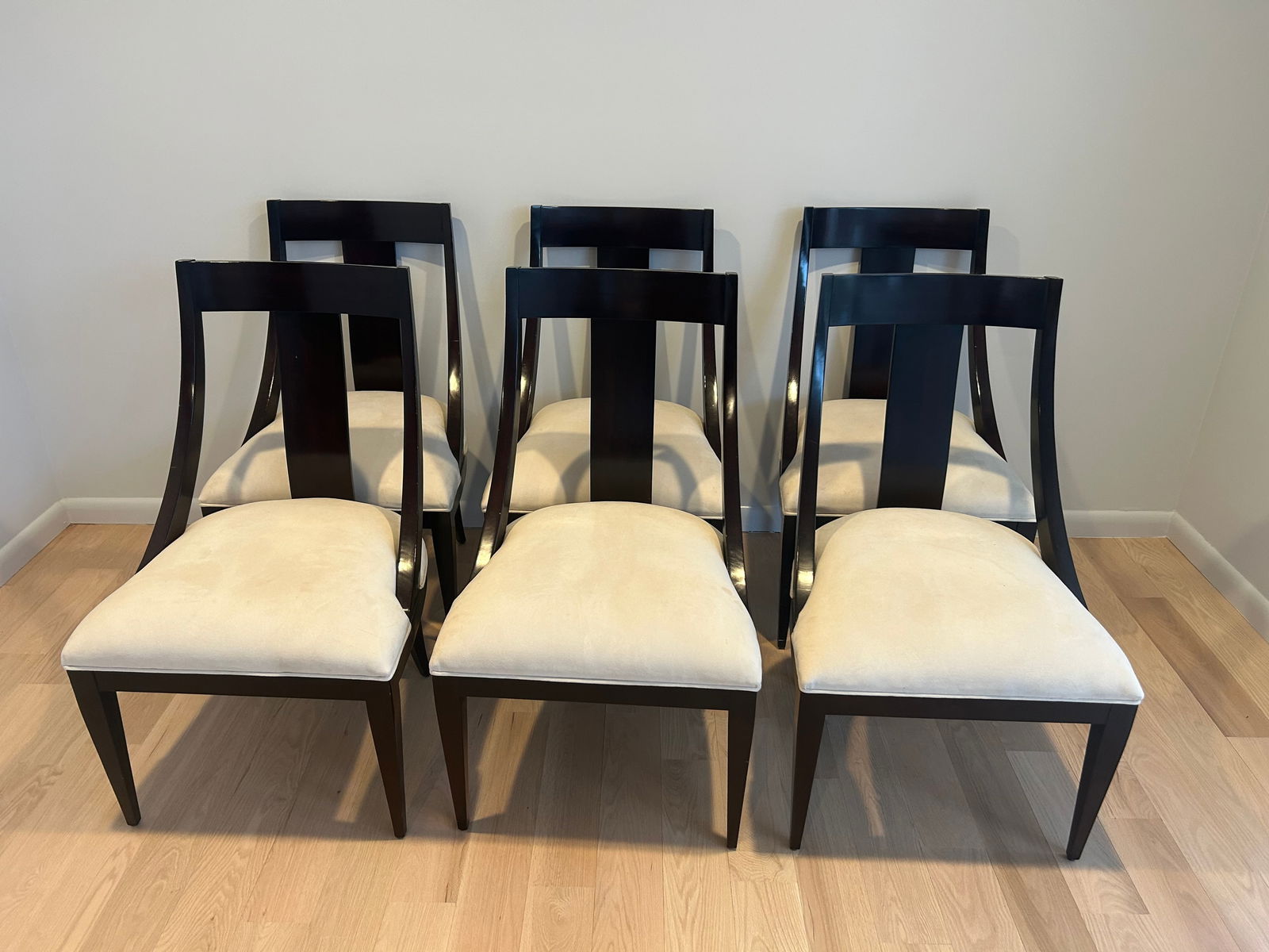 Set of 6 Empire style slope back dining chairs: This is a set of six Empire style sloped black wood dining chairs. Chairs are in good condition, two chairs have some small spots on the upholstery. See last photo. Measure 39” H x 23” W x