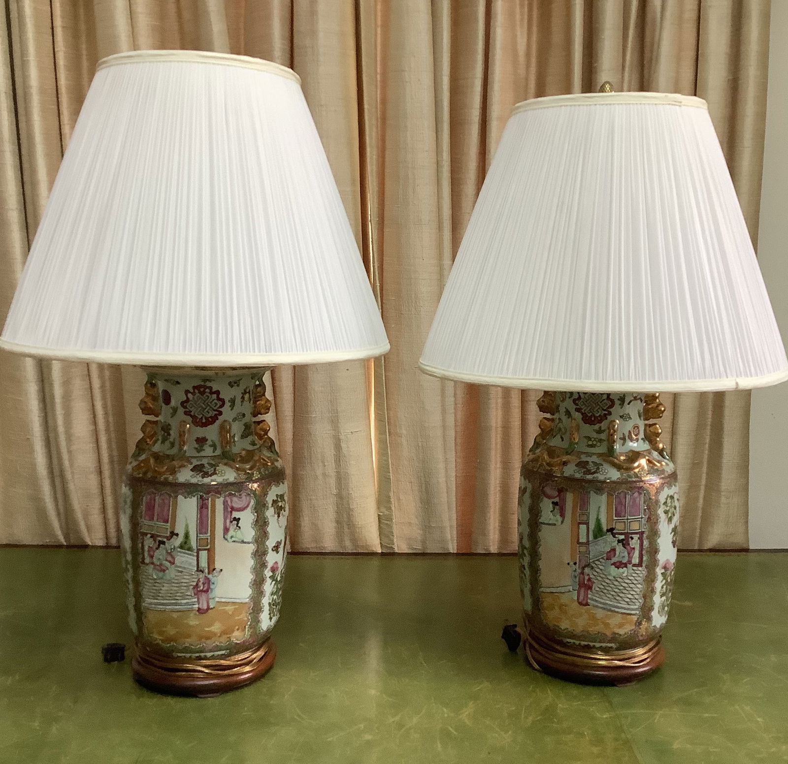 Pair of Chinese Rose Medallion Porcelain Vase Lamps: These lamps are typically made from vases mounted on a wooden Base. The porcelain features an intricate hand-painted design.30in
