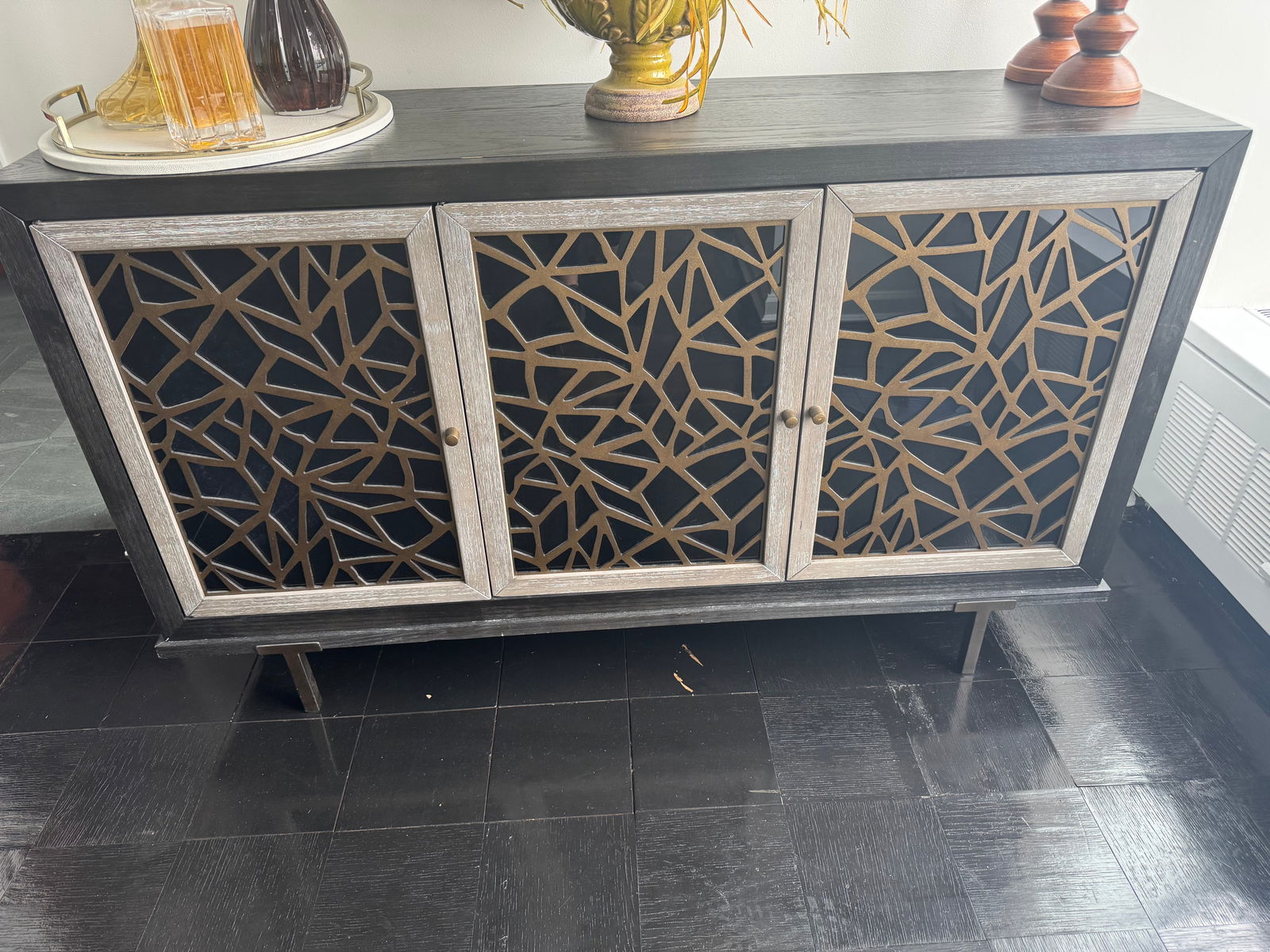 Magnussen Furniture Server: This is a Magnussen Furniture Ryker Server in Nocturne Black with a signature fractal pattern design on the glass doors. White Oak Vaneers , Nocturne Black and Coventry grey finish aged hardwood. 61 x