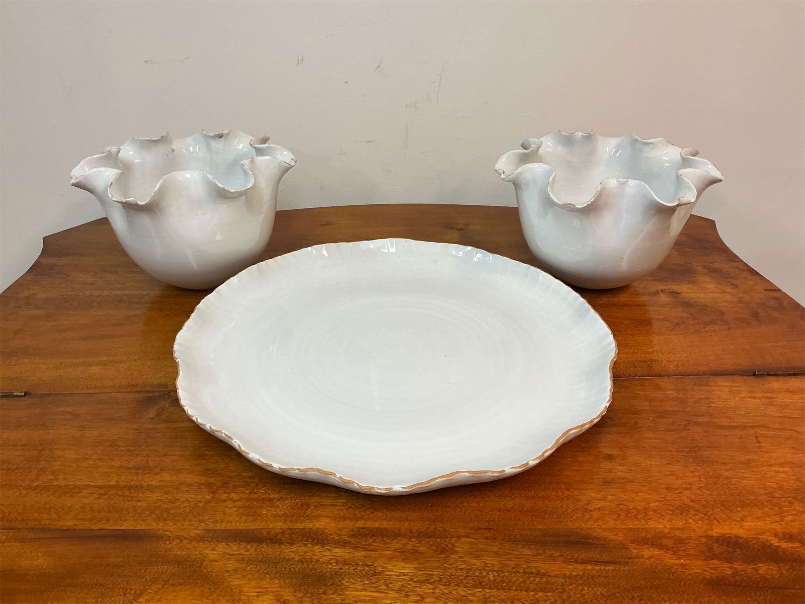 Handmade white stoneware platter and bowls from Gondolee: Experience the elegance of handmade craftsmanship with this exquisite set featuring a white stoneware platter and two matching bowls from Gondolee. The platter boasts a beautifully scalloped edge,