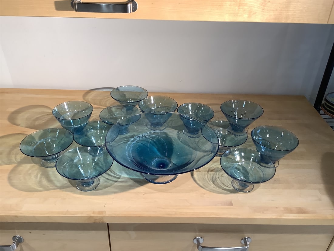 Vintage Hand Blown Serving Dish and Glasses: Hand-blown serving dish accompanied by ten matching glasses, all crafted from beautiful blue glass. The set showcases a stunning gradient of blue hues, adding a touch of elegance to any table