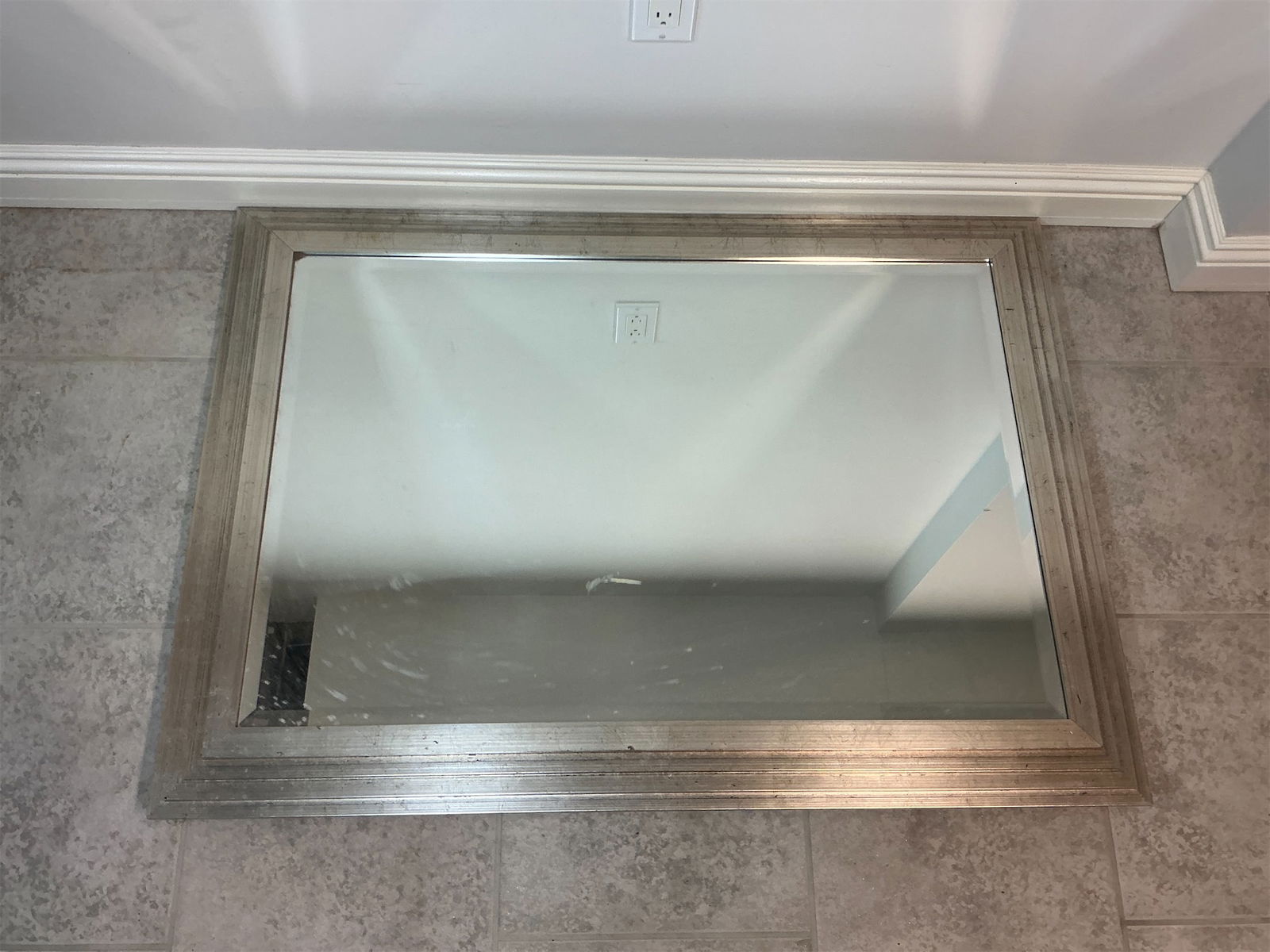 Mirror with silver finish wood frame: This elegant framed mirror features a stylish silver-toned frame with subtle textured detailing that adds a sophisticated touch to any space. The mirror s reflective surface is clear and ready to enha