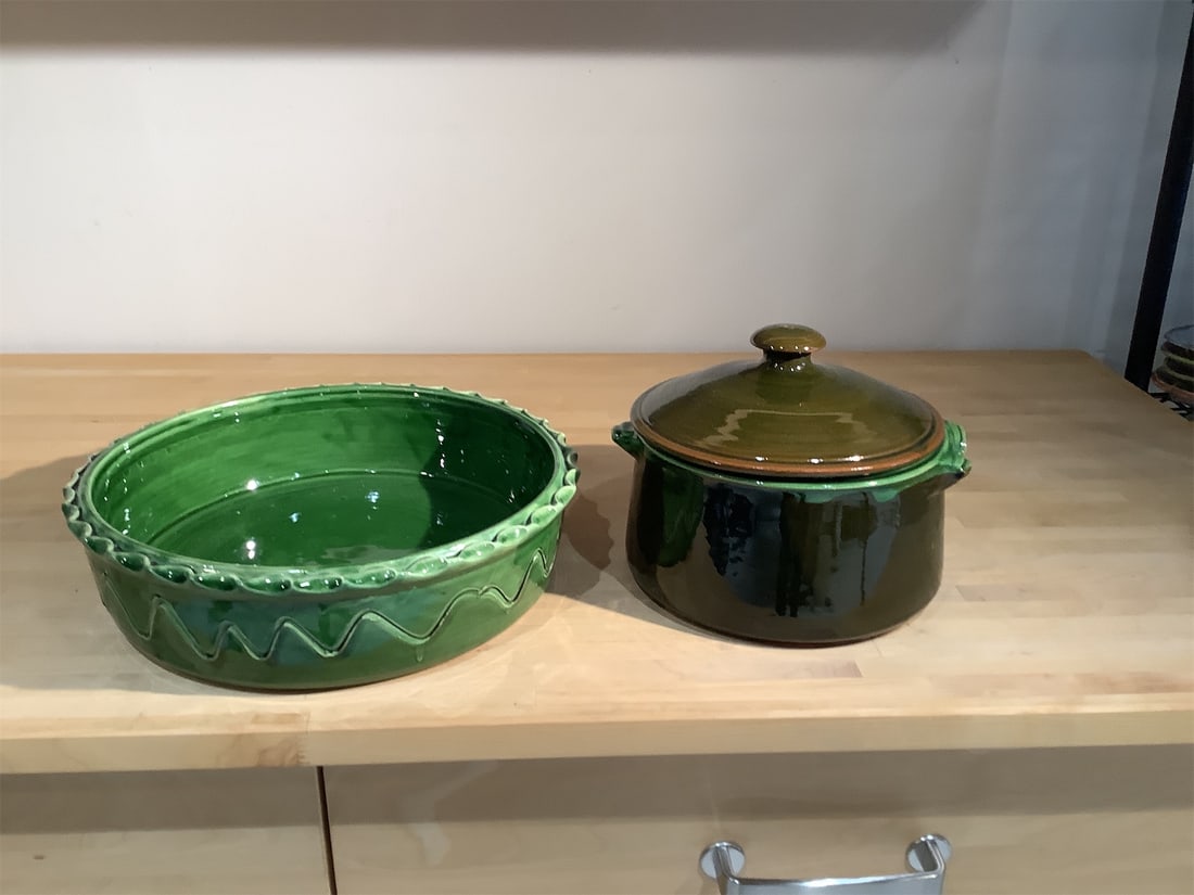 Vintage Green Glazed Ceramic Casserole Dishes: This charming set of vintage green glazed ceramic casserole dishes is perfect for both cooking and serving. The set includes a round, deep casserole dish with a matching lid and a larger serving