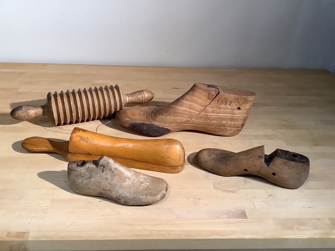 Vintage Wooden Cobblers Shoe Forms & Noodle Maker: This collection features vintage wooden cobblers' shoe forms alongside a traditional noodle maker. Comprising five distinct pieces, the shoe forms display various shapes and sizes, perfect for