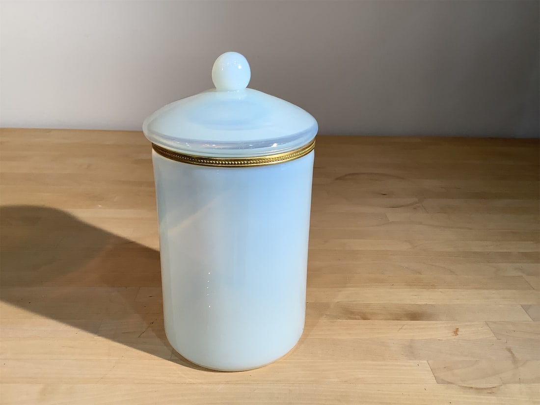 Vintage French Opaline Canister: French opaline canister is an exquisite addition to any collection. Featuring a soft, pastel blue hue, it is crafted from delicate opaline glass, known for its beautiful, translucent quality. The