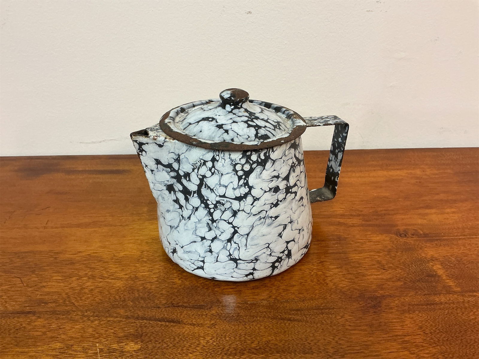 Vintage French Enamei Splatter Ware Coffee Pot: French enameled splatter ware coffee pot showcases a distinctive black and white marbled design, making it a striking piece for any collection. The unique splatter pattern adds a charming touch, while