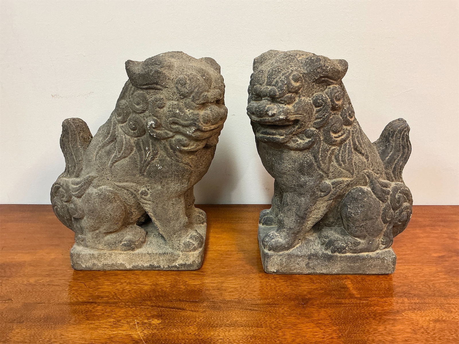 Vintage Set of 2 Concrete Foo Dogs: This listing features a vintage set of two concrete Foo Dogs, also known as guardian lions, intricately designed to enhance any decor. Each piece showcases detailed craftsmanship, with flowing manes