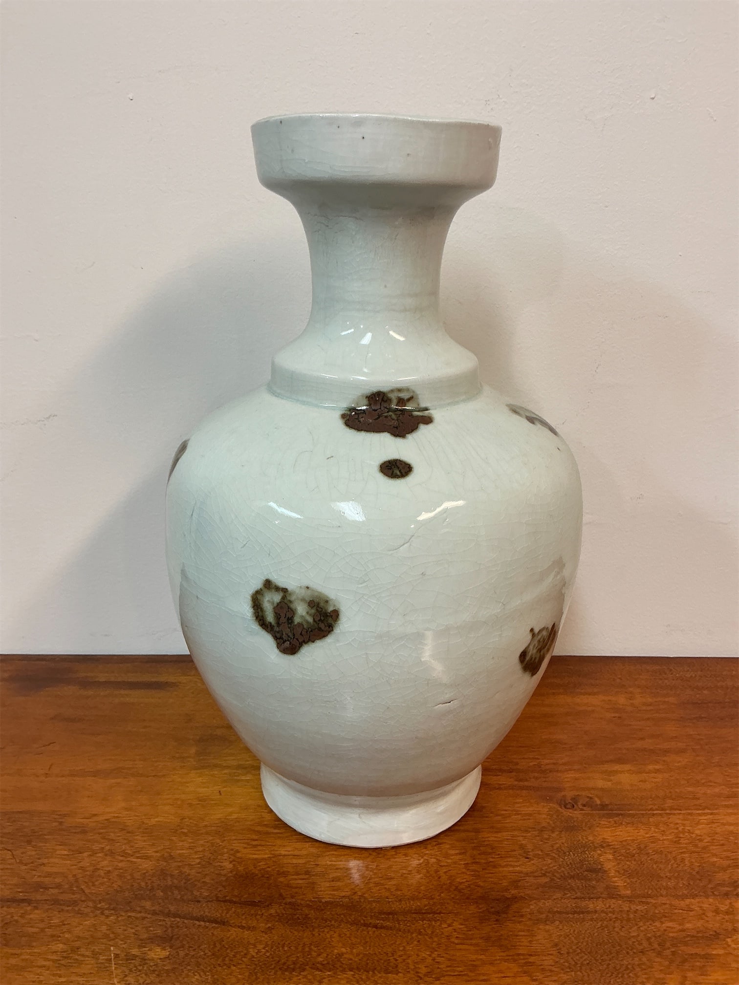 Antique Ceramic Jar with Iron Oxide Glaze: Ceramic jar showcases the distinctive Qingbai ware style, featuring a graceful, curvaceous form complemented by a flared neck. The surface is adorned with unique iron oxide brushstroke glazes,
