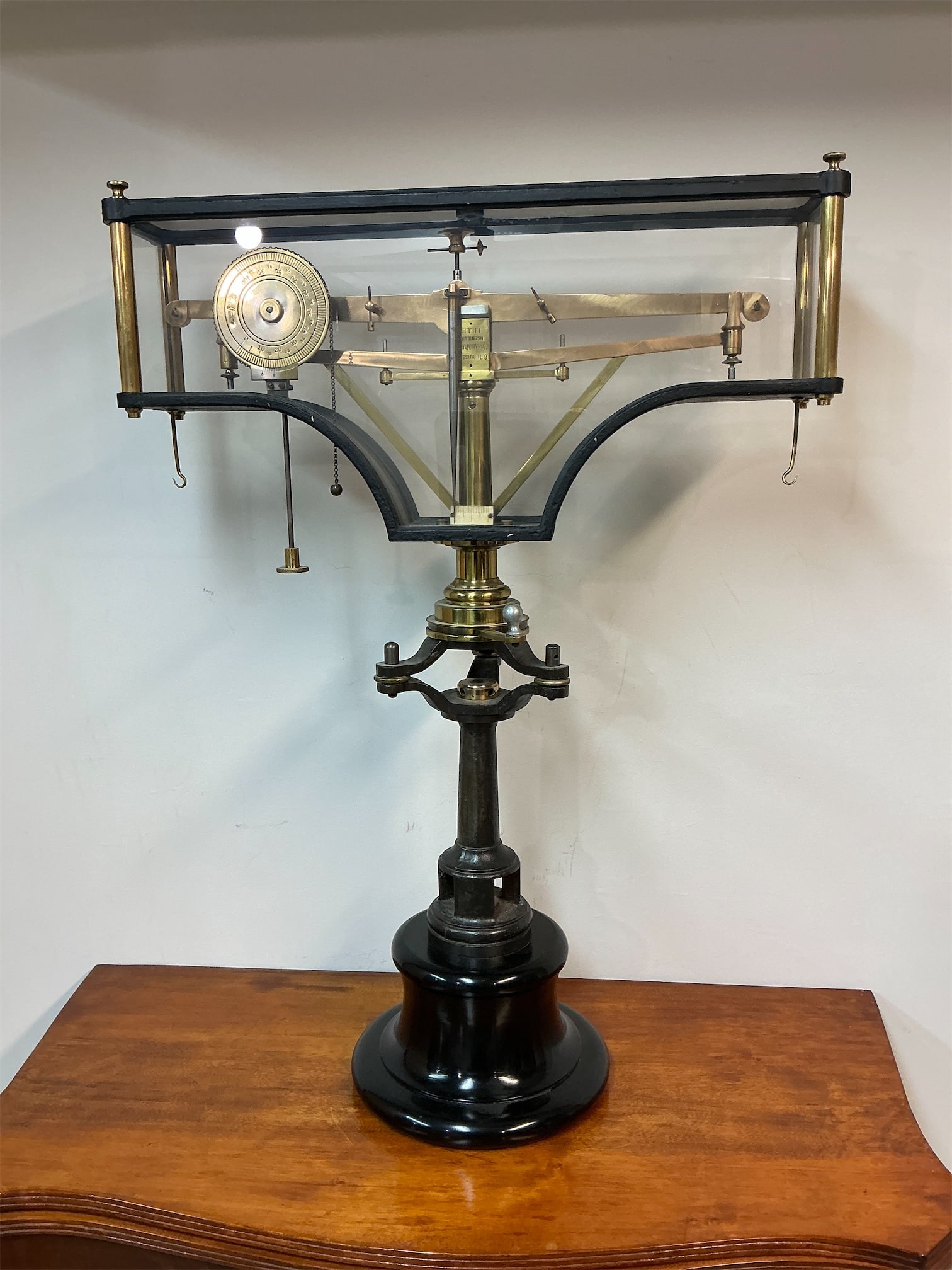 Antique Physicians Balance Scale: This antique Physicians Balance Scale is a remarkable piece of medical history, showcasing exquisite craftsmanship and intricate design. Standing tall with a striking black base, the scale features a