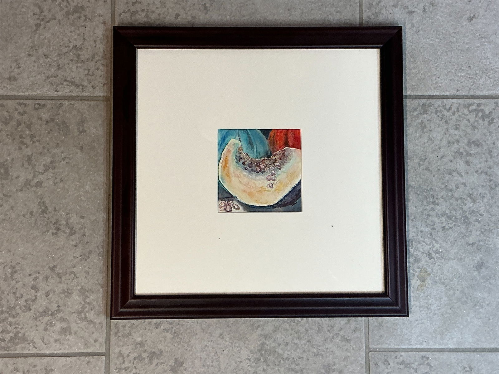 Framed watercolor What a Pumpkin by Sara Odermann: This listing features a beautifully framed watercolor titled What a Pumpkin by the artist Sara Odermann. The artwork captures the intricate details of a pumpkin slice, showcasing vibrant hues of