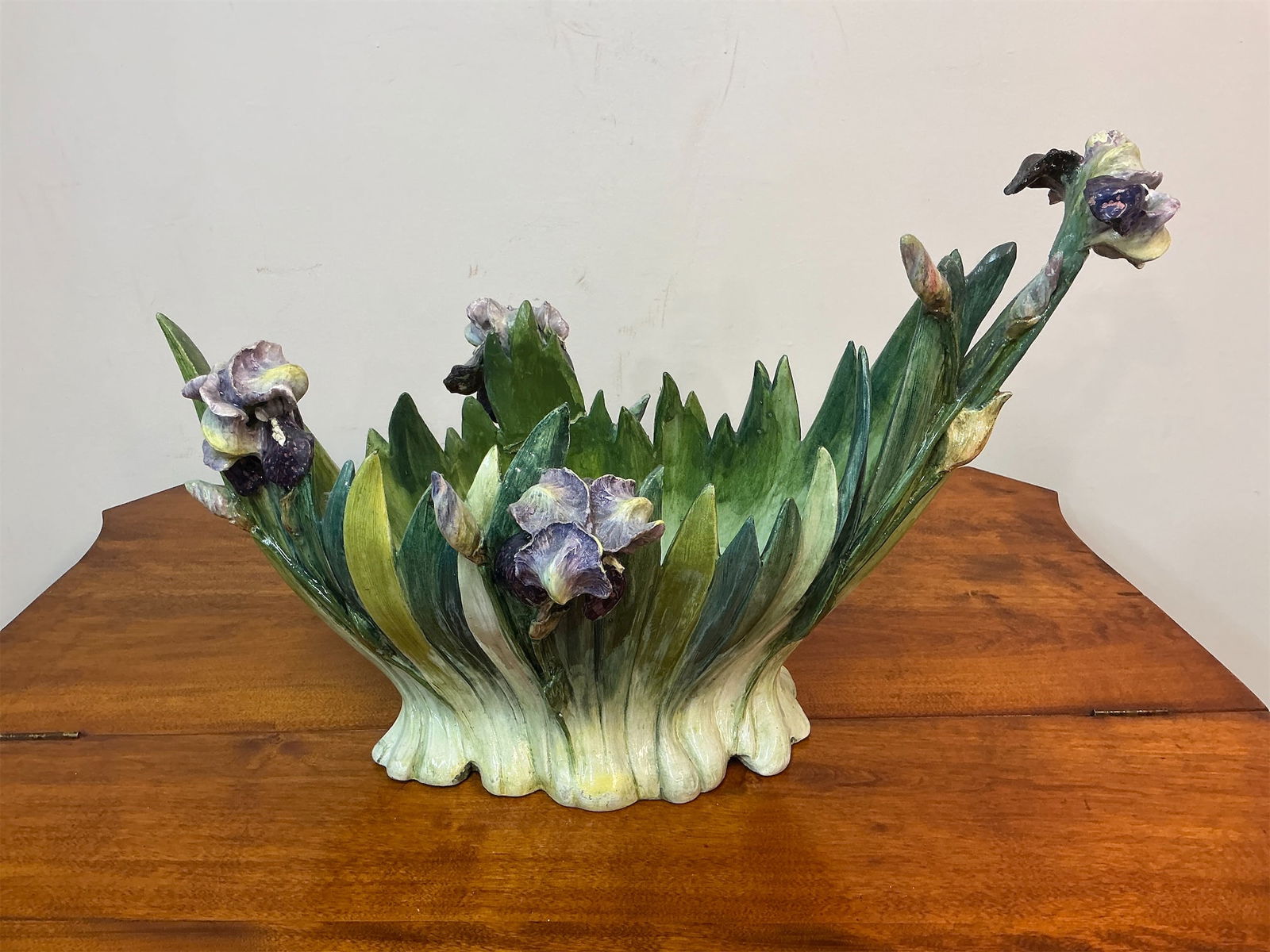 Vintage Large Hand-built Ceramic Iris Planter: This vintage large hand-built ceramic iris planter showcases a beautiful and intricate design, featuring vibrant green foliage and delicate iris blossoms in varying shades. Each flower is