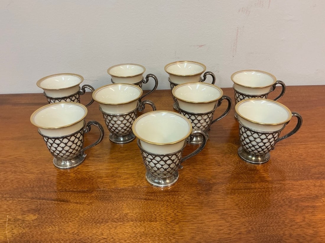 Vintage Set of 9 Tiffany & Company Sterling Silver and Lenox Porcelain Demitasse Cups: This vintage set features 9 exquisite Tiffany & Company sterling silver and Lenox porcelain demitasse cups, showcasing a timeless design. Each cup combines beautifully crafted sterling silver