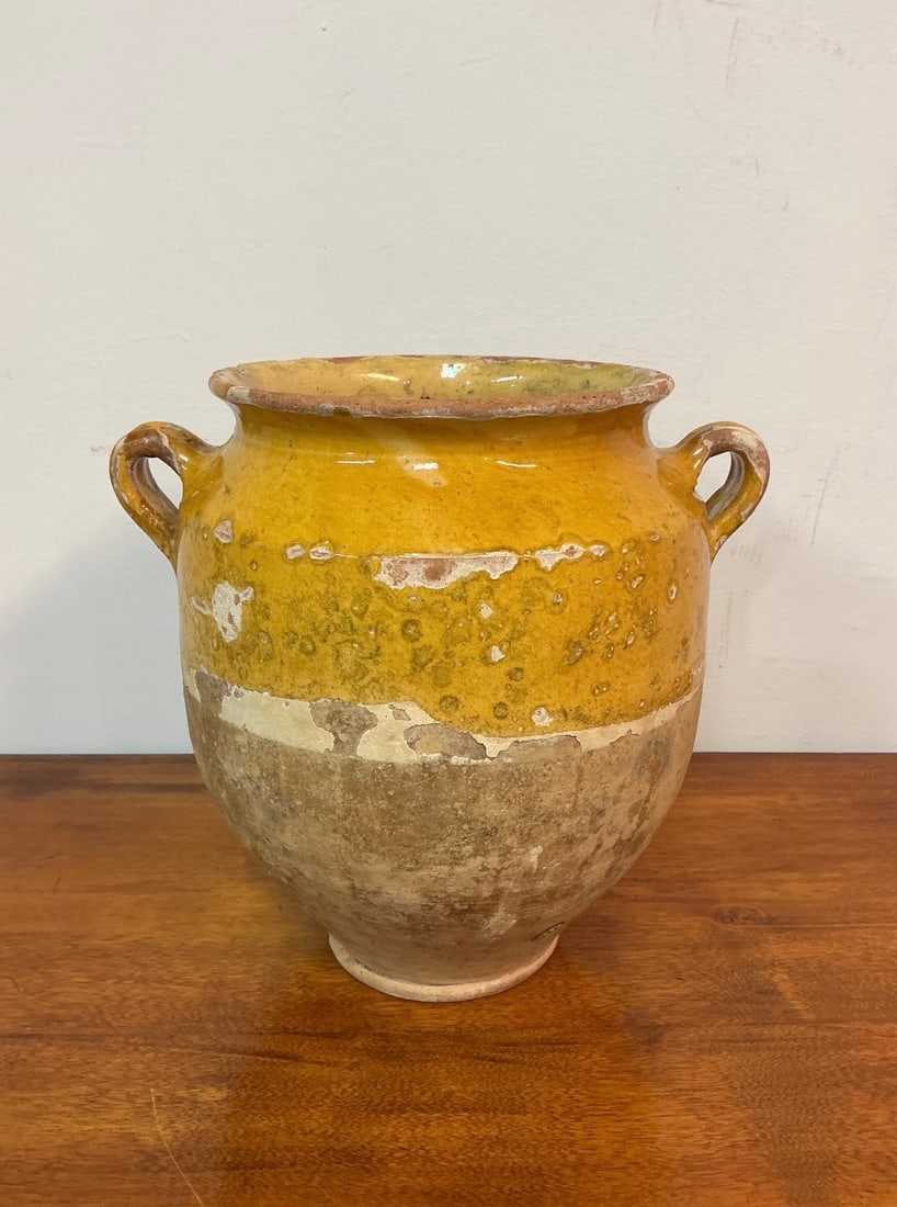 19th Century Yellow Ochre French Pottery Confit Pot: This striking 19th century French pottery confit pot showcases a vibrant yellow ochre glaze, making it a unique addition to any collection. Standing at 9 1/2 inches tall and 10 inches wide, its round