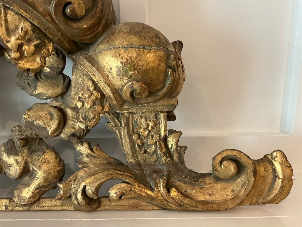 Carved French Giltwood Crest Mirror: This exquisite Carved French Giltwood Crest Mirror showcases intricate craftsmanship and luxurious detailing, making it an elegant addition to any interior. The mirror features a beautifully adorned
