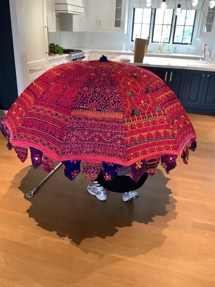 Decortive Indian Jaipuri garden umbrella: This decorative Indian Jaipuri garden umbrella showcases vibrant colors and intricate patterns, making it a stunning addition to any outdoor space. Featuring a rich combination of reds, purples, and