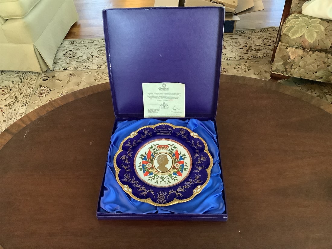 Royal Crown Derby plate: This exquisite Royal Crown Derby plate commemorates the 40th Anniversary of the Coronation of Her Majesty Queen Elizabeth II, spanning from 1953 to 1993. It features a stunning royal blue border