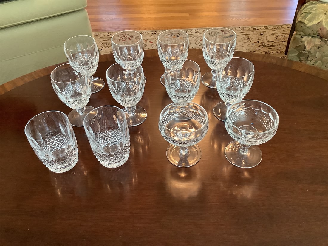 Crystal glasses: This exquisite collection of crystal glasses features a stunning variety of elegant designs, perfect for enhancing any table setting or special occasion. The set includes: - Eight beautifully cut