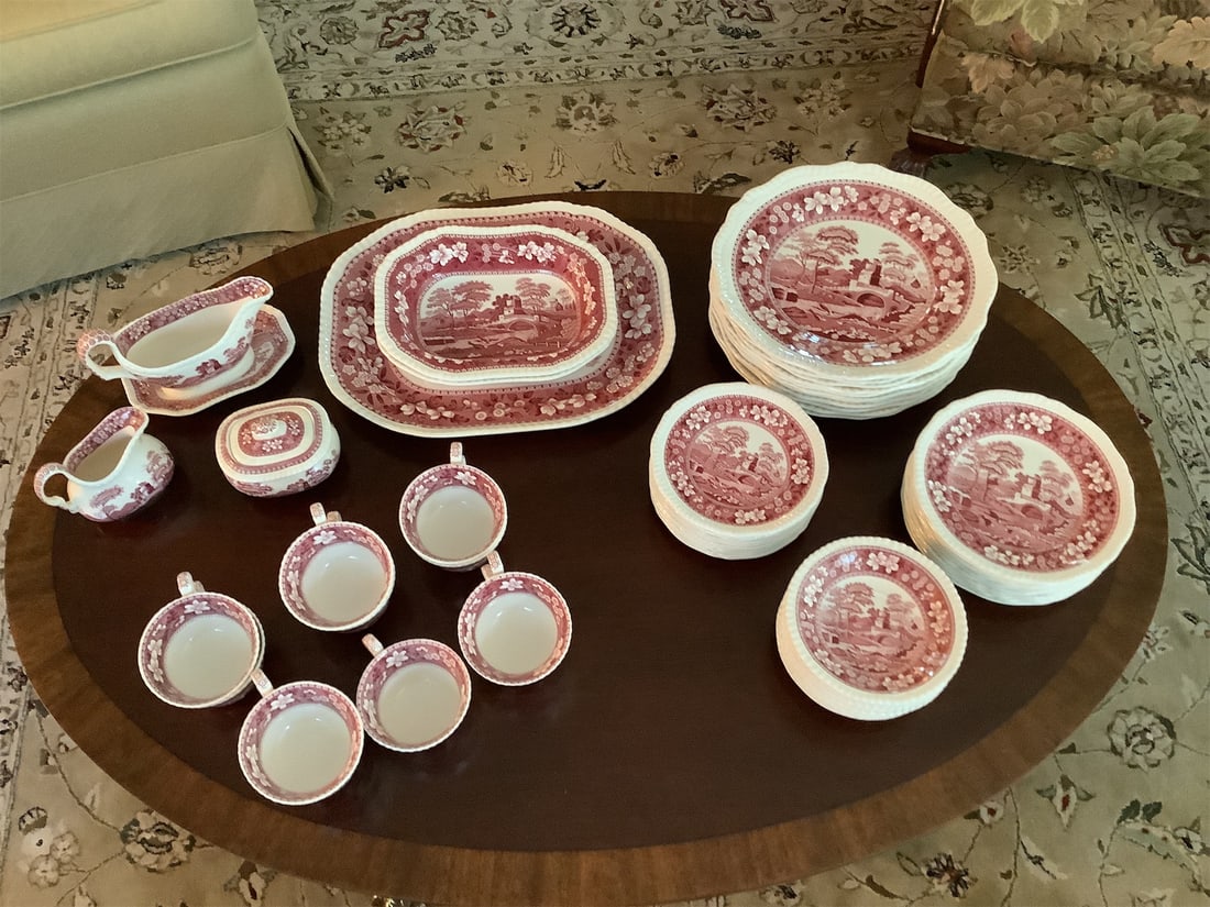 Spode chins: This exquisite collection of Spode china features a harmonious blend of elegance and classic design. The set is adorned with a rich red transferware pattern, showcasing picturesque landscapes that