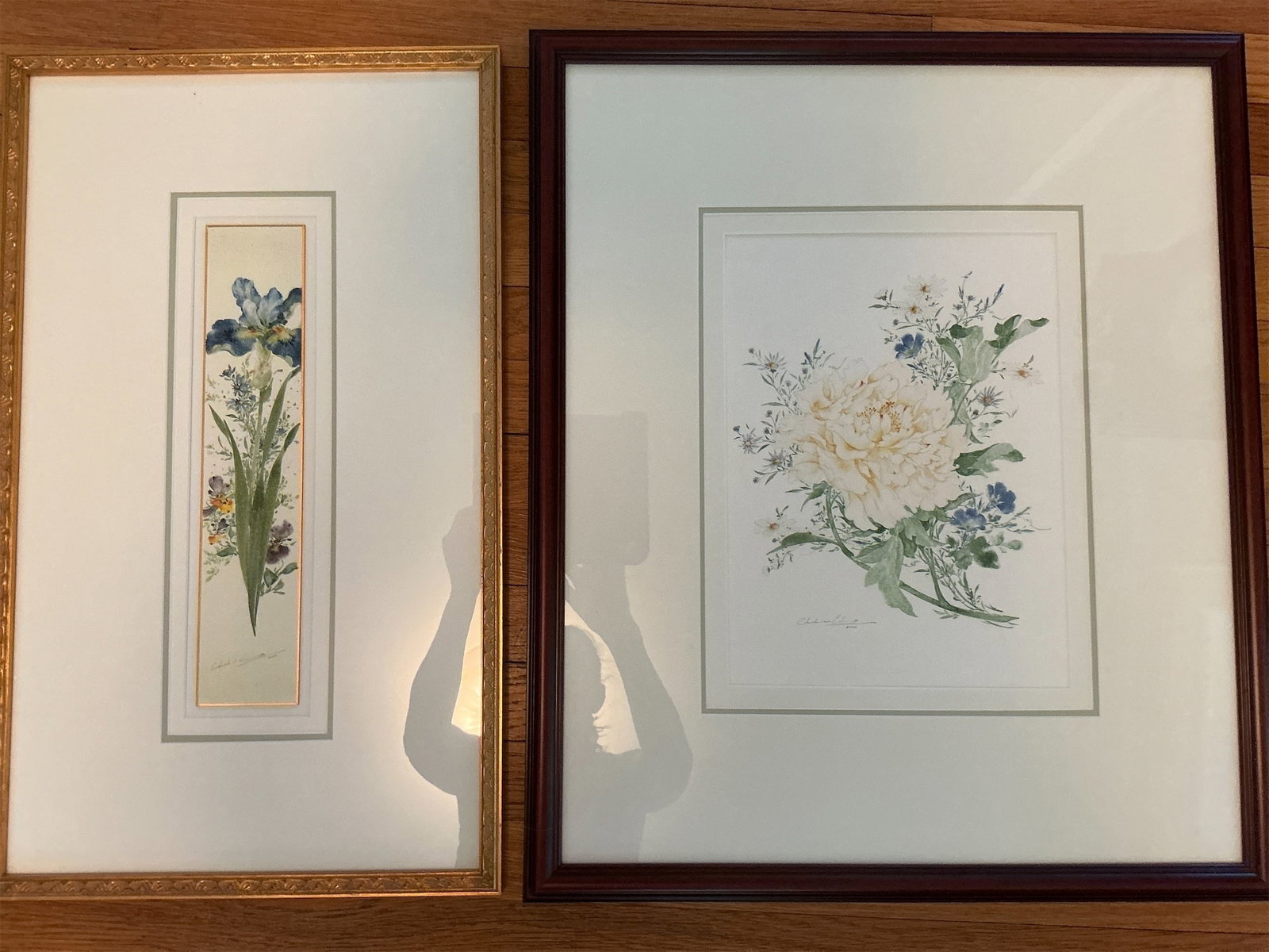 Floral Watercolors: This exquisite set of floral prints features two beautifully framed artworks, perfect for enhancing any living space. The first piece showcases a stunning peony in soft shades of yellow and