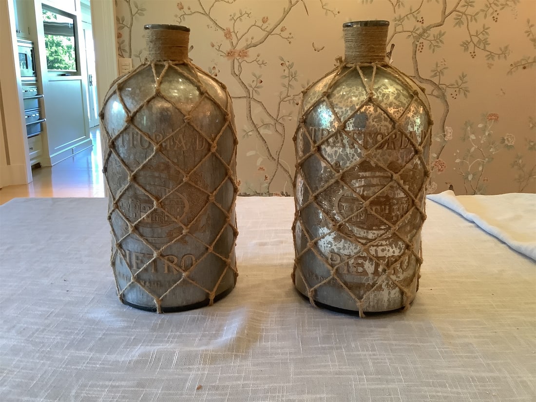 Rustic Decorative Jugs: This rustic decorative jug set features two stunning pieces, showcasing a unique blend of vintage charm and artisanal craftsmanship. Each jug has a mercury finish that reflects a subtle sheen,
