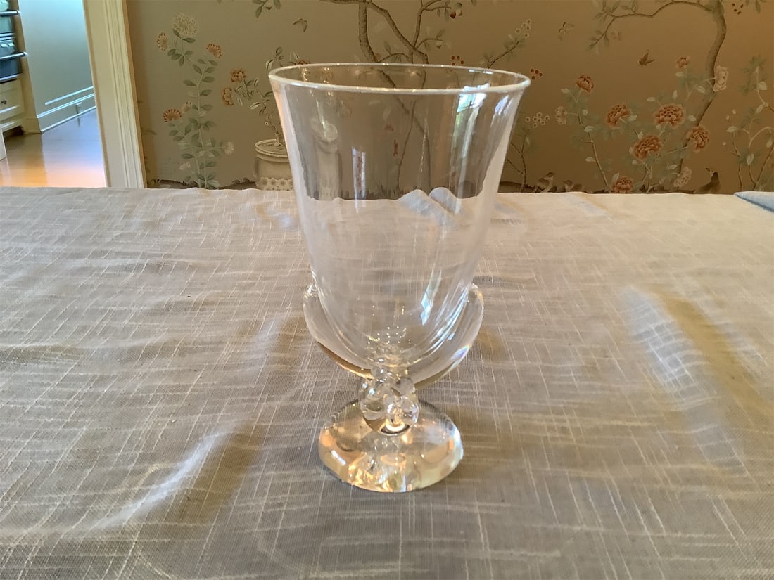Vintage Steuben Crystal Art Glass Flower Vase by George Thompson: This elegant glass vase features a classic design with a beautifully crafted shape, showcasing its clear transparency and refined aesthetics. The vase stands on a sturdy pedestal, accentuated with int