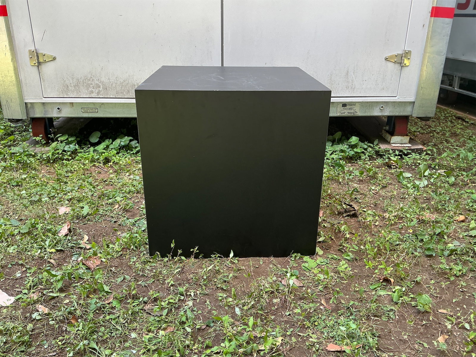 Black Cube: This black cube is a versatile and stylish piece, perfect for a variety of uses. With a sleek, modern design, it can serve as an accent table, a display pedestal, or even a minimalist storage