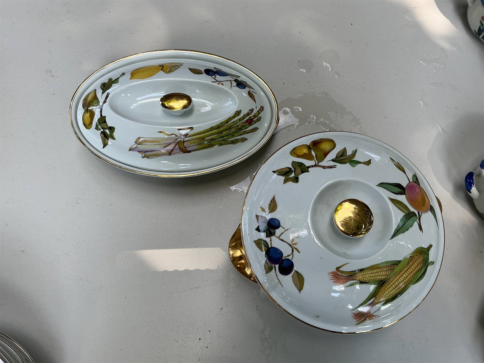 Royal Worchester Svesham Serving Set: This Royal Worcester Svesham Serving Set features exquisite hand-painted designs that showcase vibrant fruits and vegetables, including asparagus, pears, peaches, blueberries, and corn. Each piece is