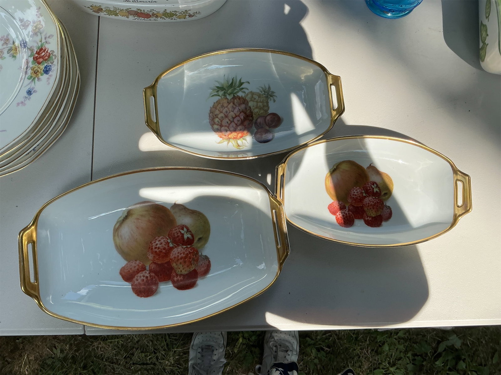 Thomas Bavaria Fruit Bowls of 3: This elegant set of three fruit dishes by Thomas Bavaria showcases exquisite craftsmanship and vibrant designs. Each dish features lively illustrations of fruits, including pineapples and