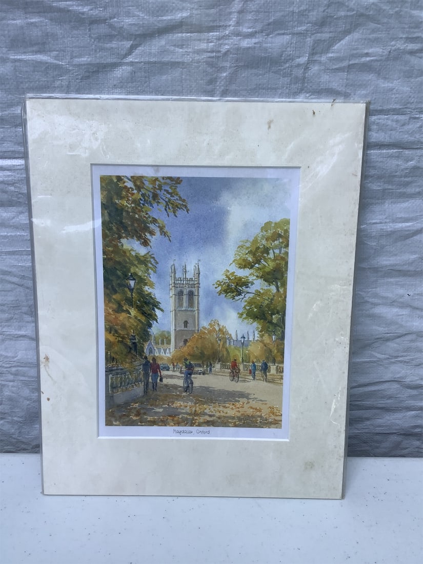 "Magdalen, Oxford" Watercolor Painting: This stunning watercolor painting titled "Magdalen, Oxford" captures the charming essence of Oxford's renowned Magdalen College. The artwork showcases vibrant autumnal foliage lining a pathway,