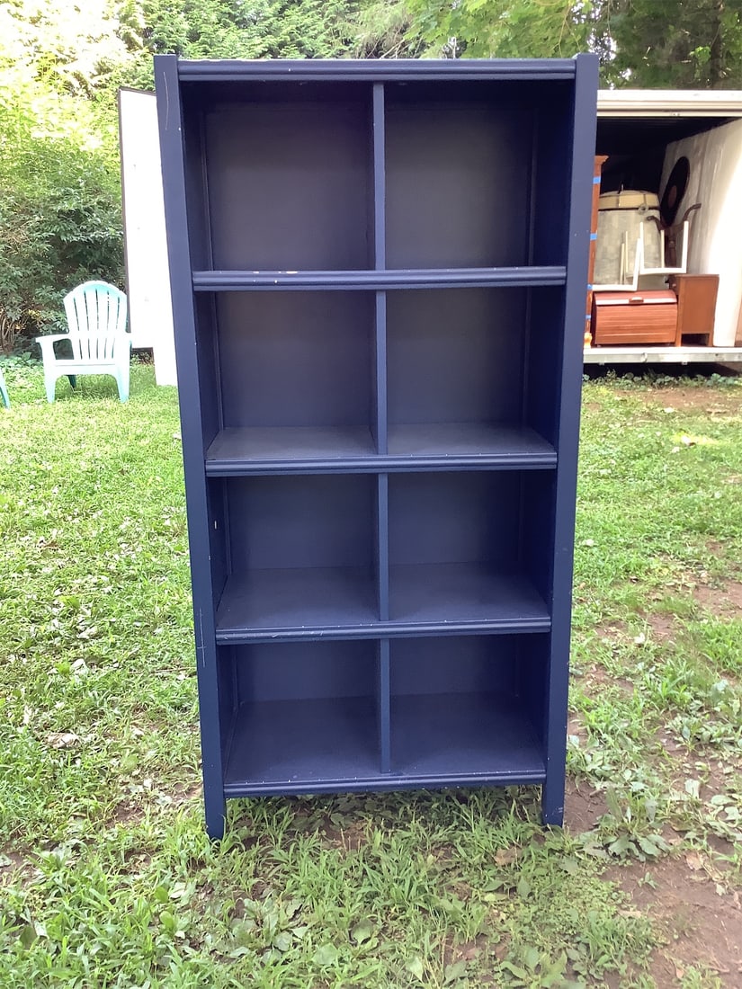 Blue 8 Cube Shelf Unit: Elevate your organization with this stylish Blue 8 Cube Shelf. Designed with functionality in mind, this shelf features a sleek blue finish and offers eight spacious cubbies for storage or display. It