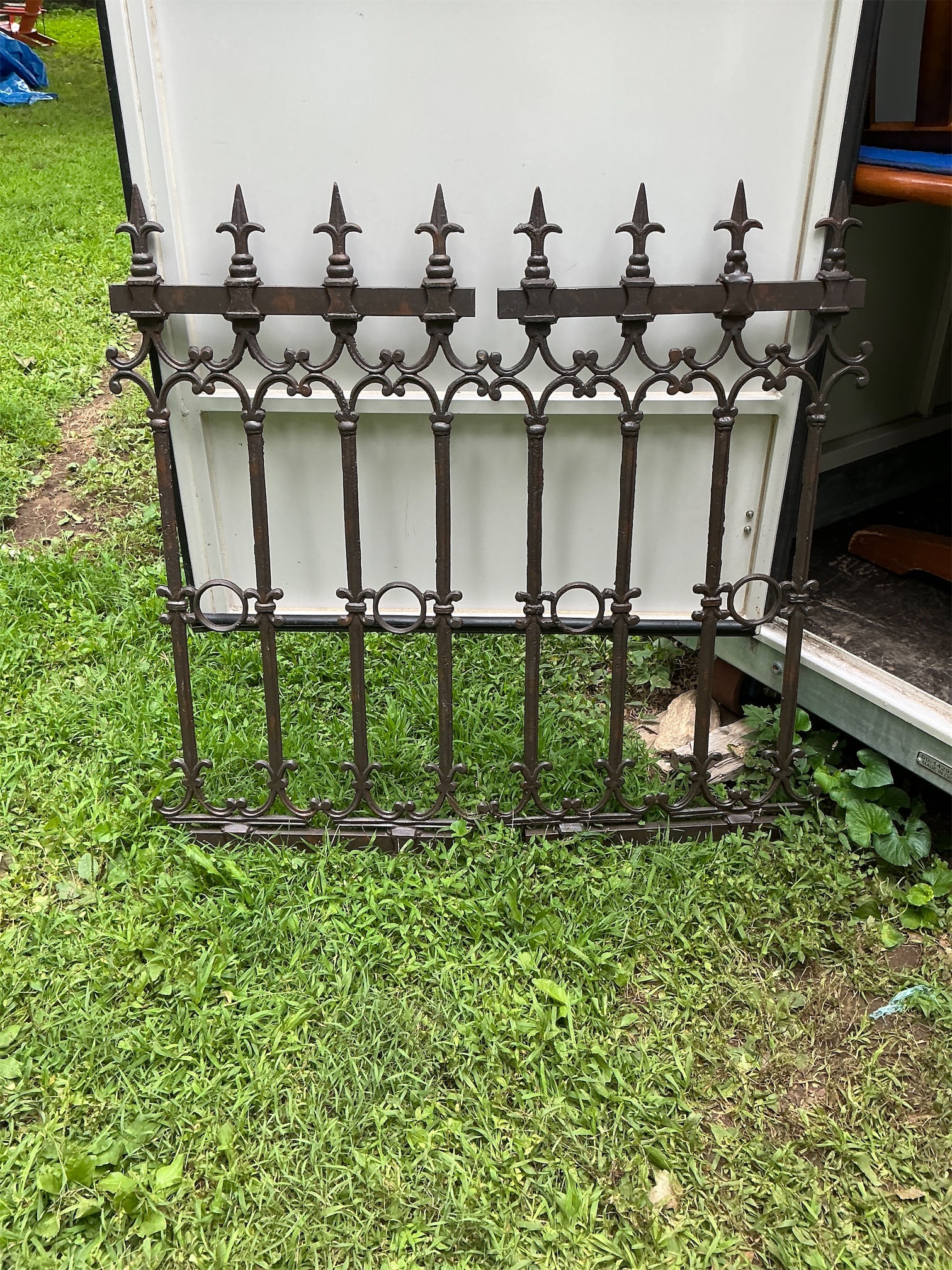 Victorian Wrought Iron Fence: These 2 elegant wrought iron fence piece features intricate detailing, lending a classic touch to any outdoor space. The design includes decorative finials and a series of vertical bars adorned with c