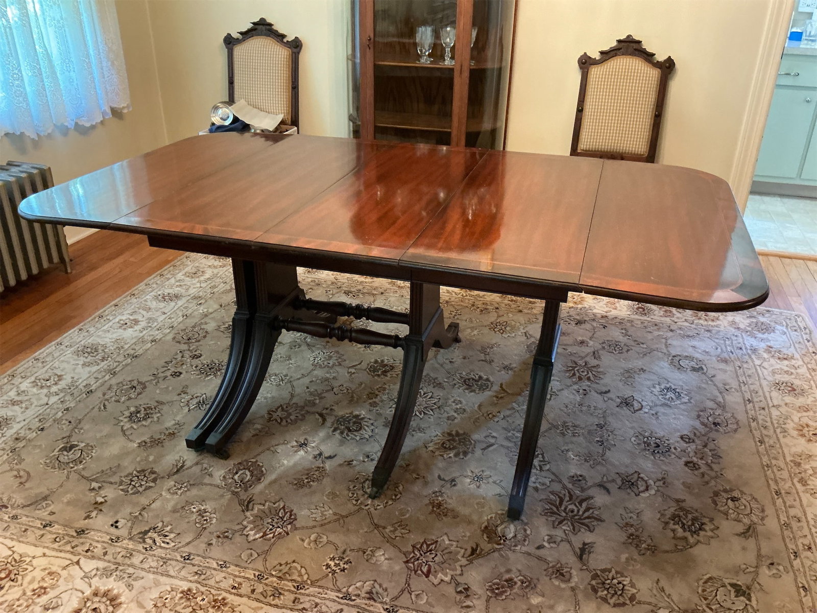 Brandt Dining Table: This elegant Brandt Dining Table showcases exquisite craftsmanship and timeless design. Featuring a rich mahogany finish, the table boasts a stunning rectangular shape that can comfortably