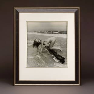 Marilyn 'Playful on the Beach' by André De Dienes: Artist: André De Dienes (1913-1985)Title: Marilyn 'Playful on the Beach' by André De DienesDate: 1949Medium: Vintage gelatin-silver photograph on double-weight paper.Limited Edition: NoGenre: