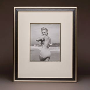 Marilyn 'Playful in a Swimsuit' by André De Dienes: Artist: André De Dienes (1913-1985)Title: Marilyn 'Playful in a Swimsuit' by André De DienesDate: Original photo taken in 1949. This iteration was created in 1992 by the artist's wife and signed